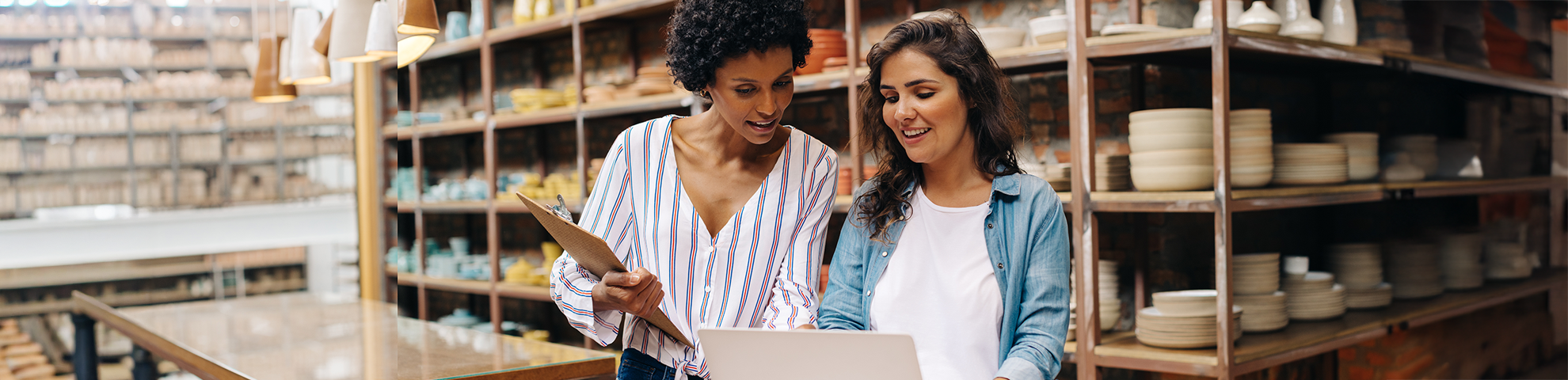 Business owners looking at a laptop computer